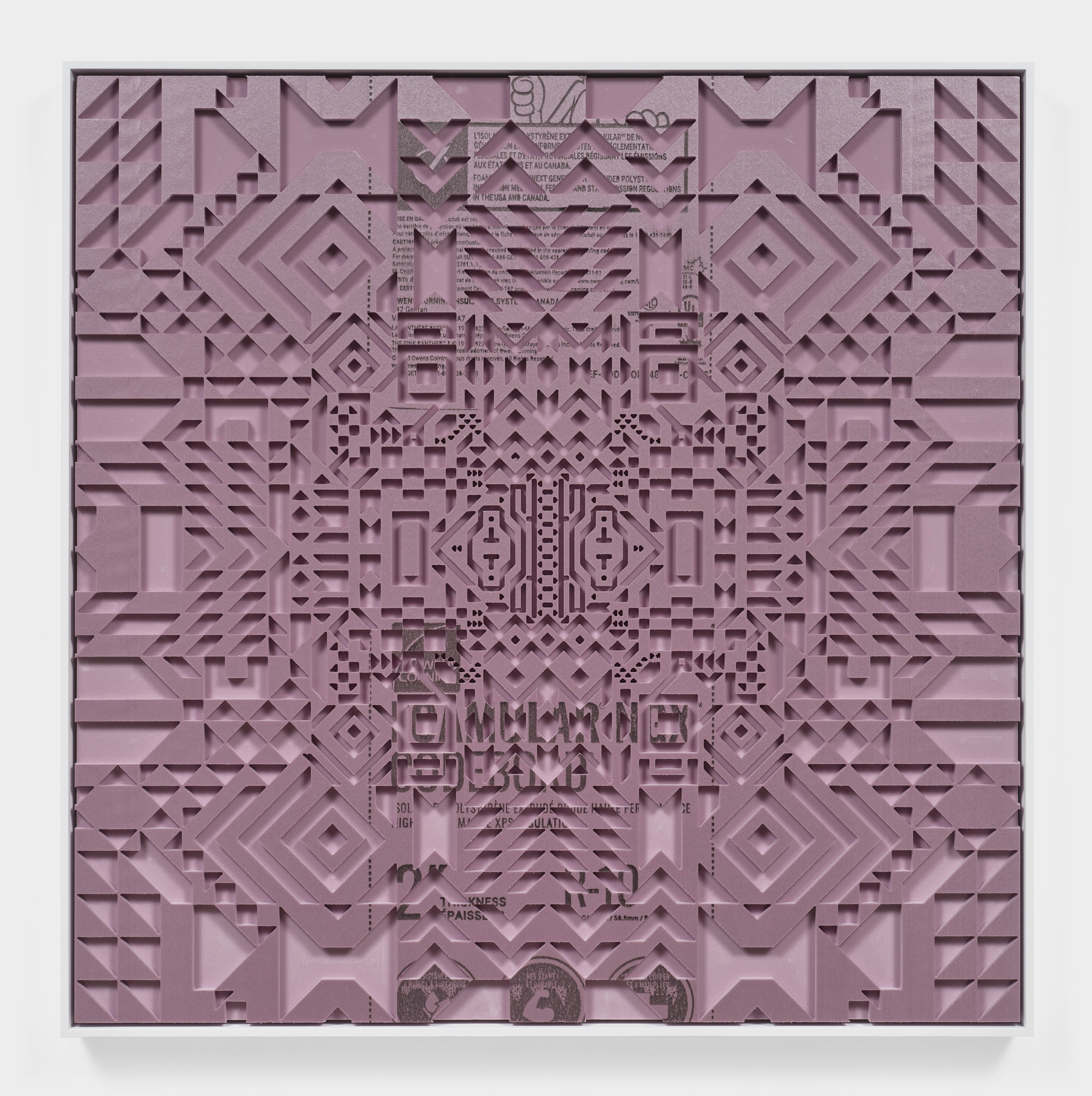 A square framed artwork with intricate patterns cut out from a mauve insulation panel.