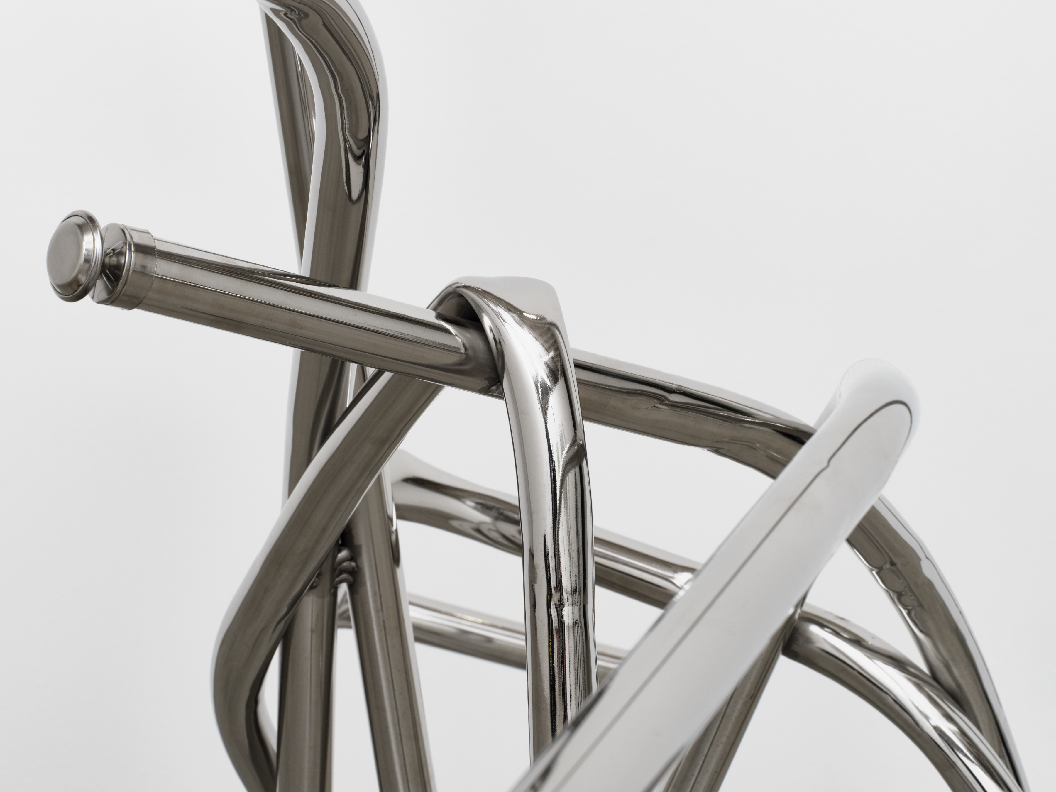 Detail of interlocking steel tubes in Josh Callaghan's "Cursive Faun Chair"