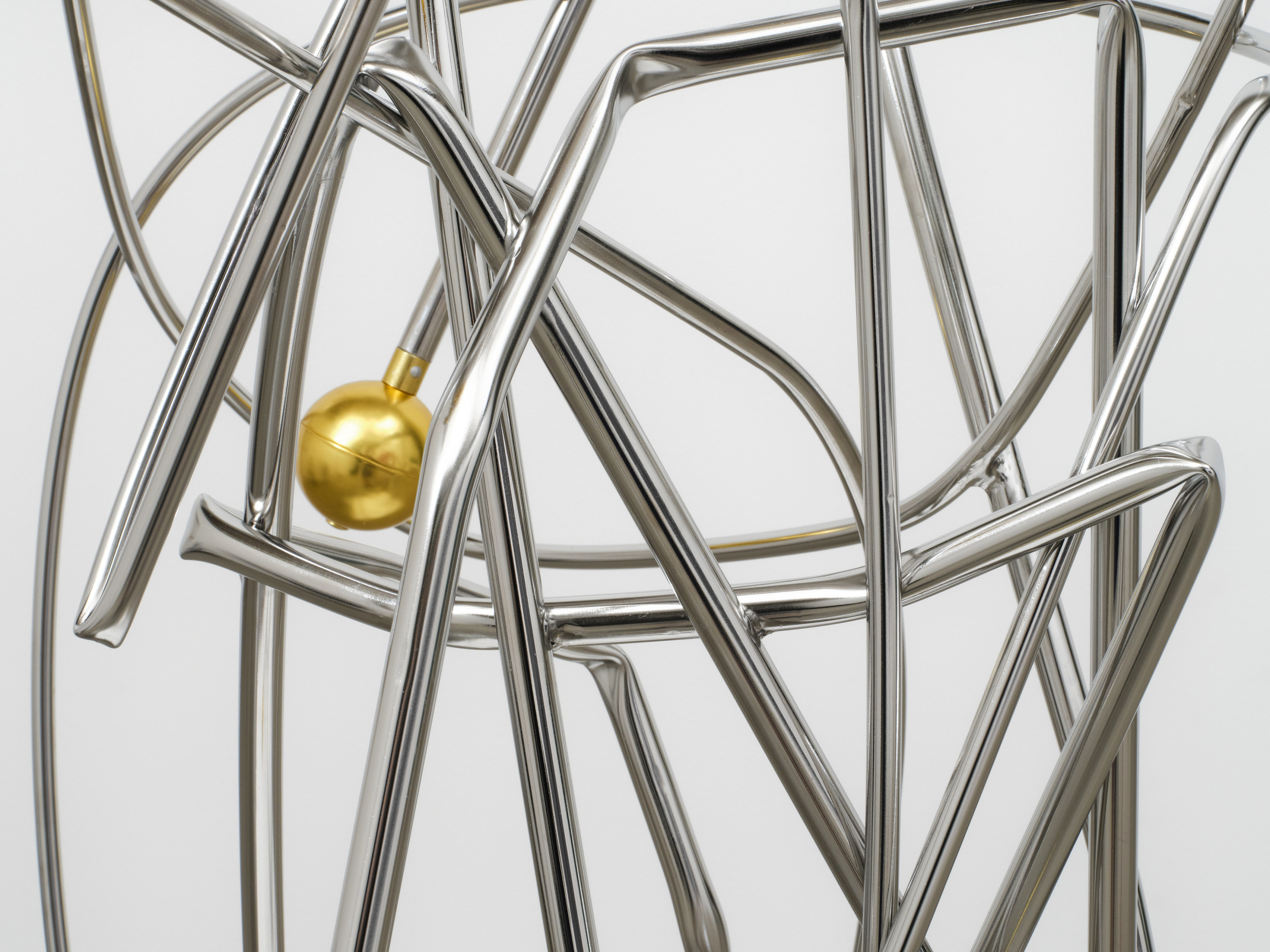 A detail of entangled silver bars in Josh Callaghan's "Executive Display Structure"