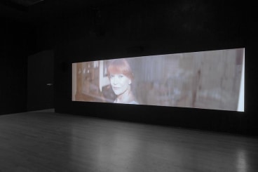 dark gallery with a video projection