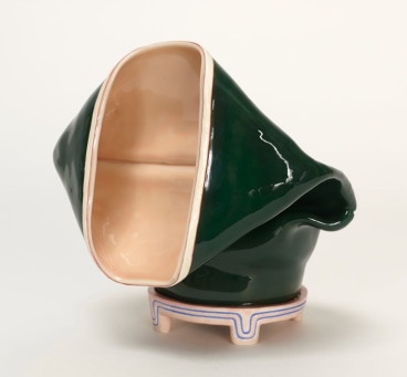 Folded over clay pot with outer green glaze and inner tan glaze by Kathy Butterly.