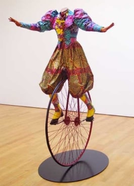 YINKA SHONIBARE, Lady on Unicycle, 2005. Life-size fiberglass mannequin, Dutch wax-printed cotton, steel