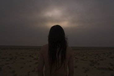 silhouette of a woman looking away from the viewer