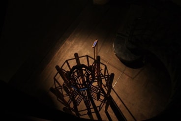 top view of orange contraption in the dark