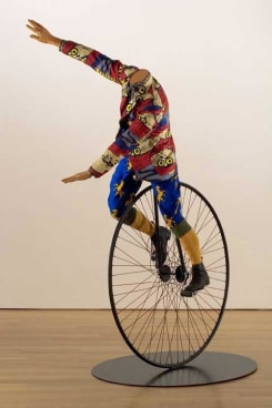 YINKA SHONIBARE, Man on Unicycle, 2005. Life-size fiberglass mannequin, Dutch wax-printed cotton, steel
