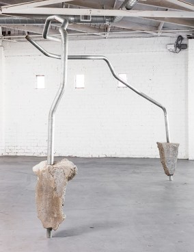 The physical threshold of &ldquo;Concrete Island&rdquo; is Ruben Ochoa&rsquo;s Pinky Swear&mdash;two arcs of metal frozen overhead in a twisting dance. These galvanized steel posts have their &ldquo;feet&rdquo; mired&nbsp;in blocks of poured concrete&mdash;the meta-material of this city. Concrete is to L.A. what marble is to Rome.&nbsp;