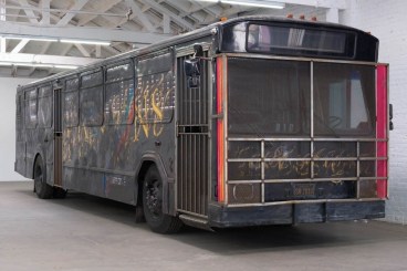 STERLING RUBY, &quot;BUS,&quot; 2010. BUS, STEEL, SPRAY PAINT, STAINLESS STEEL SPHERES, SPEAKERS, SUB-WOOFERS, TIRES, FOAM, VINYL, T5 FLORESCENT LIGHT FIXTURES, T5 BULBS, ELECTRICAL CONDUIT.
