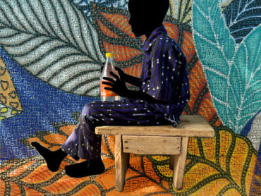 The silhouette of a sitting boy wearing blue pajamas with white dots is shown in front of a background of colorful leaves. The boy holds a soda bottle.