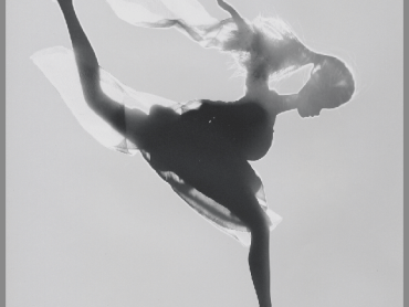 The silhouette of a Barbie running with an overly wide stance is shown in this black and white image