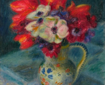 still life with blue background and vase of anemones and tulips