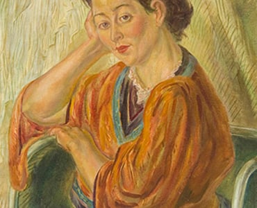 Portrait of a woman in a 'Chinese' blouse seated in an armchair