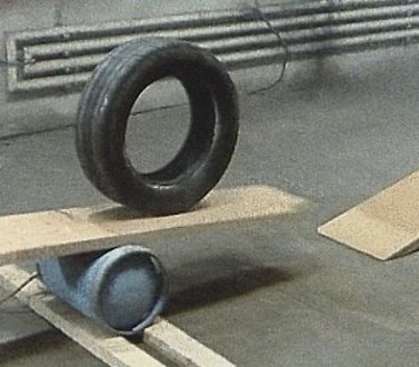 wheel balancing on a raised plank
