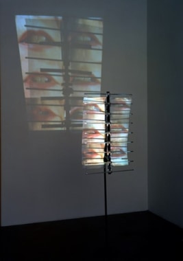 I in the Sky, 2001. Sony DPL CS2 projector, DVD player, DVD, metal, Performance by: Constance DeJong, 68 x 22 x 11 inches + equipment. MP 307