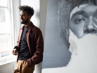 Kohshin Finley in his his Hollywood studio with an in-progress portrait of his friend Antoine J. Girard.
