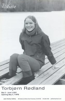 Photo of girl sitting on dock by lake
