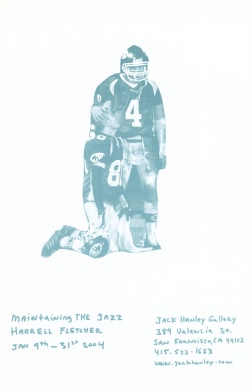 Blue image of two football players embracing