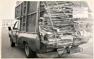 Photo of pick up truck carrying cardboard