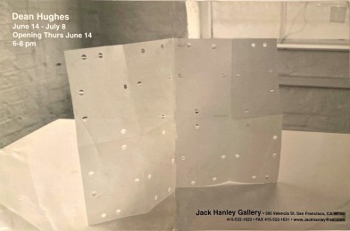 paper with punched holes in gallery, black and white poster
