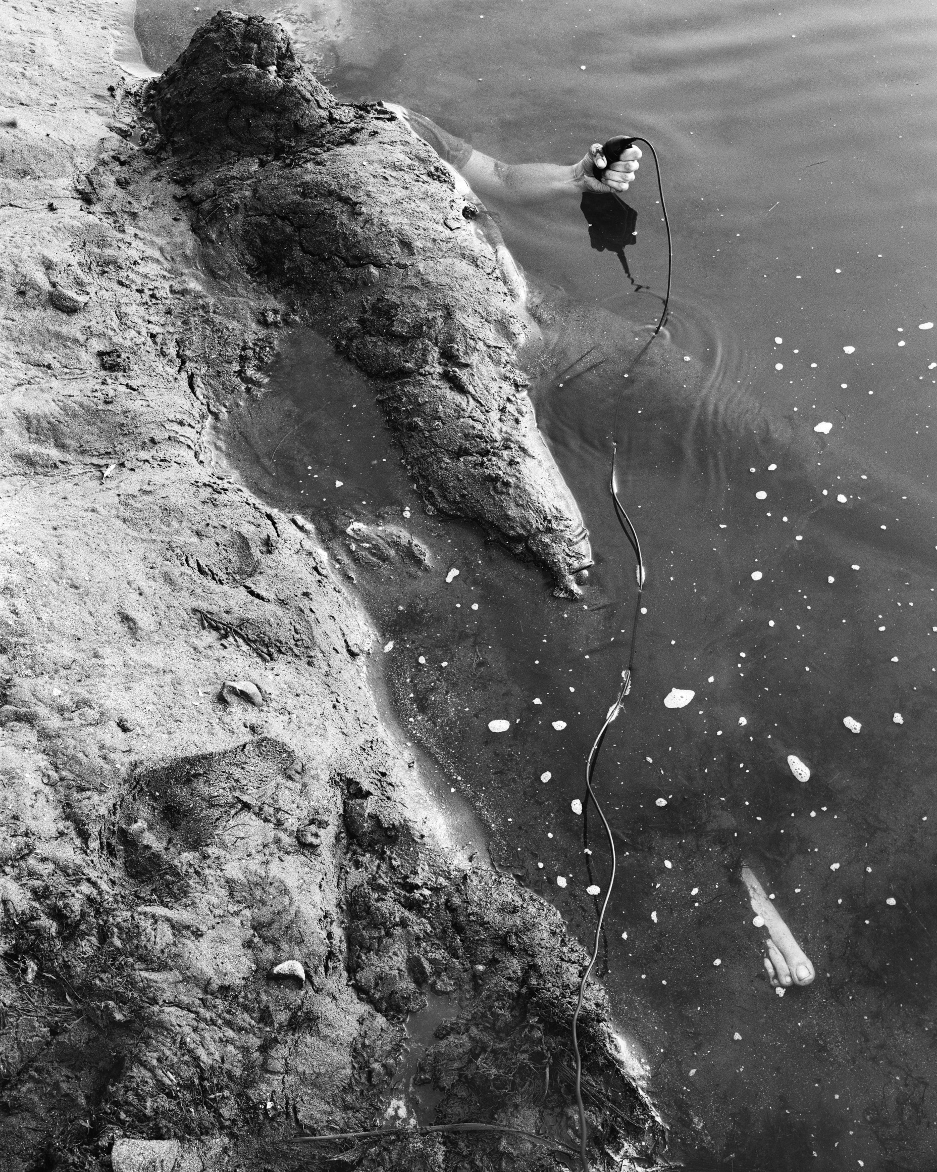 Jenny Calivas, Self-Portrait While Buried #14, 2021. Gelatin silver print, 50 x 40 inches.