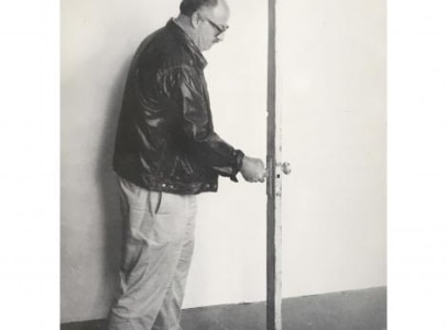 Richard Allen Morris with Giacometti’s Door, 1980, wood and metal, 79 X 6 X 5 in. Photo: Mary Kristen and Anna O’Cain. Exhibition brochure for Richard Allen Morris: A Sense of Place, Mandeville Gallery, University of California San Diego, February 27 – March 27, 1988 and La Jolla Museum of Contemporary Art Downtown, April 16 – July 3, 1988.