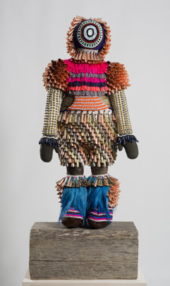 Jeffrey Gibson Eternal Return,&nbsp;2014 Wool, glass and plastic beads, acrylic yarn, deer rawhide, angora goat fur, quartz crystals, tin and copper jingles, steel and brass studs, artificial sinew, nylon thread, metal wire, steel rods, found railroad tie 86 x 27 x 14 in including wood block (218.44 x 68.58 x 35.56 cm) Collection of The Philbrook Museum, Tulsa, Oklahoma