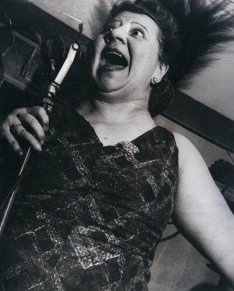 Lisette Model - Singer at Caf&eacute; Metropole, c. 1946 Gelatin silver print, 19 3/8 x 15 1/2 inches ; Bruce Silverstein Gallery