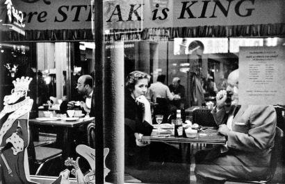 Frank Paulin - Couple in Cafe Window, Times Square, New York City, 1956 Gelatin silver print mounted to board, printed c. later | Bruce Silverstein Gallery