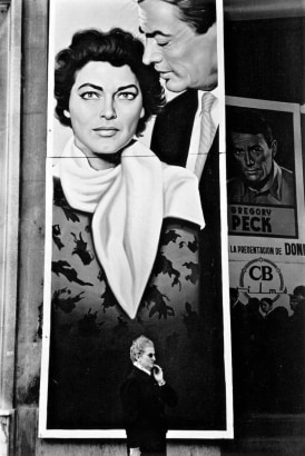 Frank Paulin - Woman in Front of Movie Poster, Seville, Spain, 1960 Gelatin silver print mounted to board, printed later | Bruce Silverstein Gallery