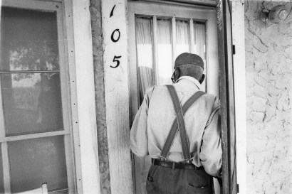 Chester Higgins -  Uncle March Fourth McGowan entering his home, New Brockton, Alabama, 1981