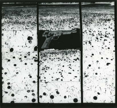John Wood - Gun in Landscape: Daisies, 1965 Gelatin silver print mounted to board, printed c. 1965 | Bruce Silverstein Gallery