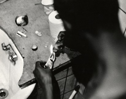 Shawn W. Walker (b. 1940), Cooking Dope, Preparing to Shoot It, 1970