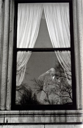 Frank Paulin - Man in Window Saluting, New York City, 1956 Gelatin silver exhibition print mounted to board, printed c. 1956 | Bruce Silverstein Gallery