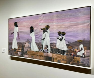 horizontal mixed media work showing a line of larger than life figures dressed in white walking along a city's rooftops at dawn