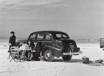 Marion Post Wolcott, Winter Visitors Picnic on Running Board of Car, Sarasota, Florida, 1941, 11 x 14 inch Gelatin silver print, Signed on verso