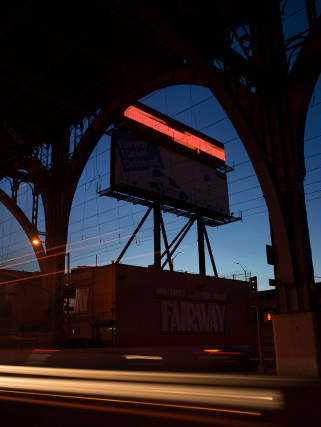 Lynn Saville,&nbsp;Billboard Under the Viaduct, 2018. Archival pigment print, 24 x 20 inches.