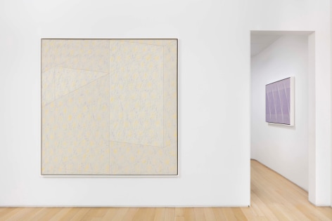 installation view of paintings in a white room