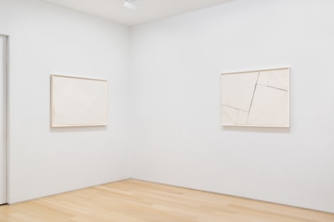 installation view with white abstract drawings