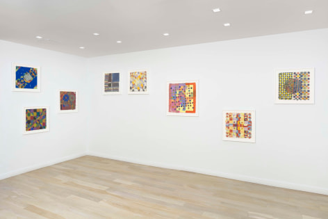 installation view of framed works on paper