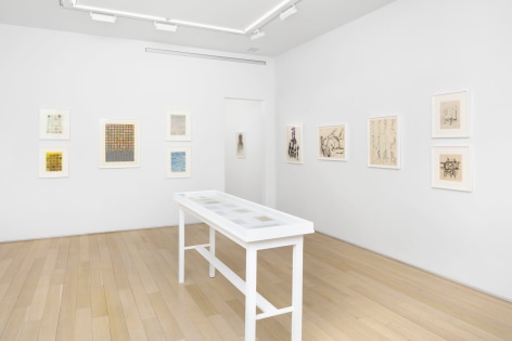 installation view with framed drawings