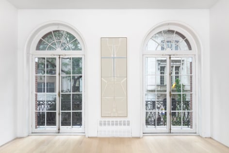 white gallery space with art on walls between windows