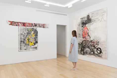 installation view of paintings in a white room