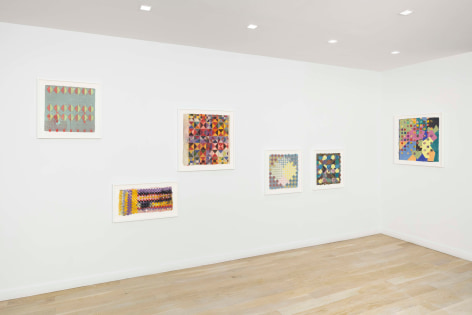 installation view of framed works on paper