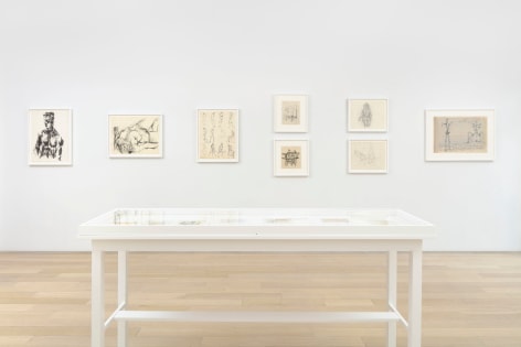 installation view with framed drawings