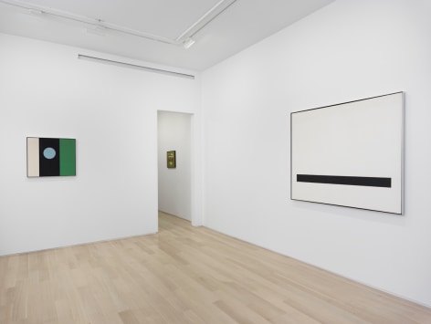 installation view of three abstract paintings