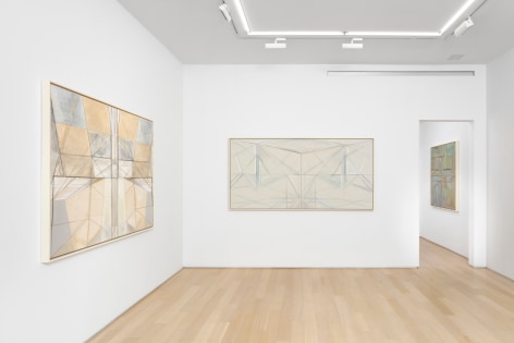 white gallery space with art on walls