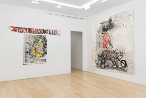 installation view of paintings in a white room