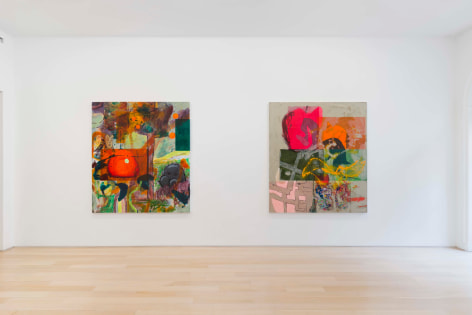 installation view of paintings in a white room