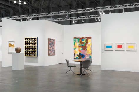 installation view with artworks in a white room