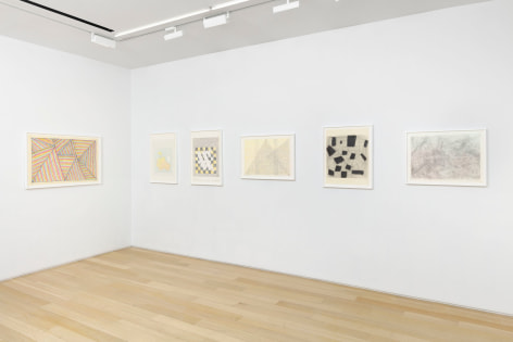 installation view with framed drawings