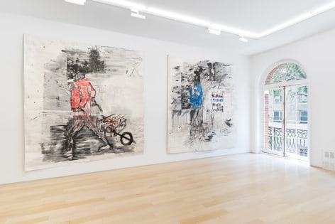 installation view of paintings in a white room